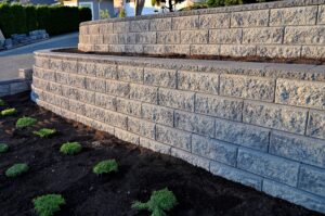 retaining,wall,2,tier,concrete,blocks,in,gray,new,construction